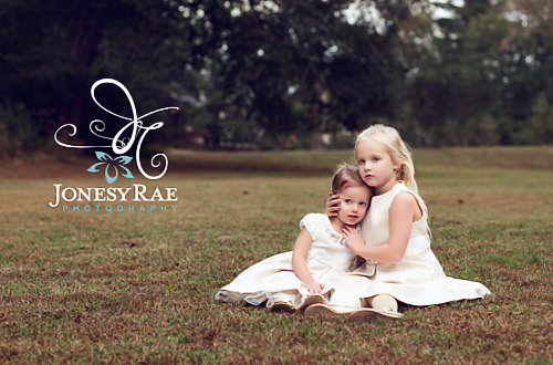 sisters by the award wining diana toone of jonesy rae photography in sandy utah of the salt lake city area with newborn baby and child portraits (1)